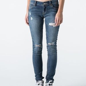 Distressed stretch skinny jeans